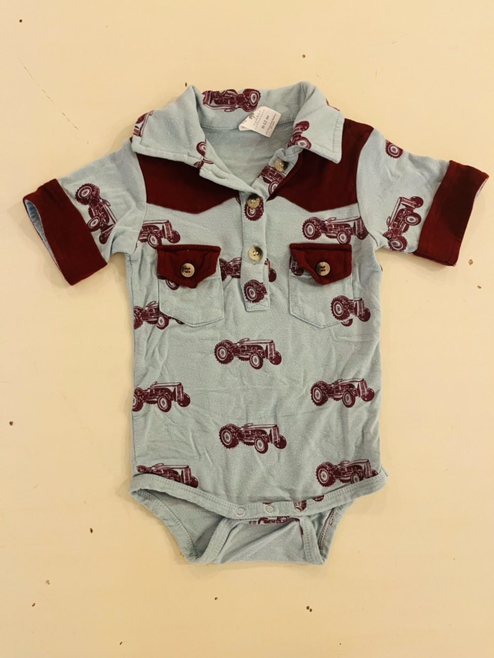 Kate Quinn Tractor bodysuit